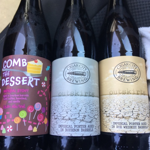 CIGAR CITY BARREL AGED OUTSKIRTS RYE WHISKEY AND BOURBON BARREL AGED IMPERIAL PORTER, COMB THE DESSERT BOURBON BARREL Aged